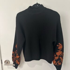 Black and orange sweater